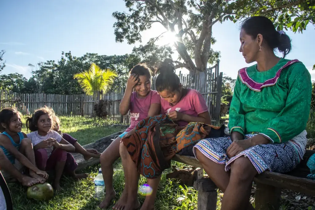 Peru Indigenous Communities group of jungle native people weaving together